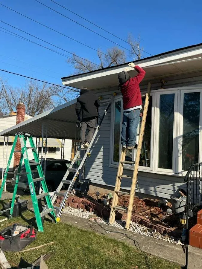 Restoration crew performing exterior repair in Hamilton